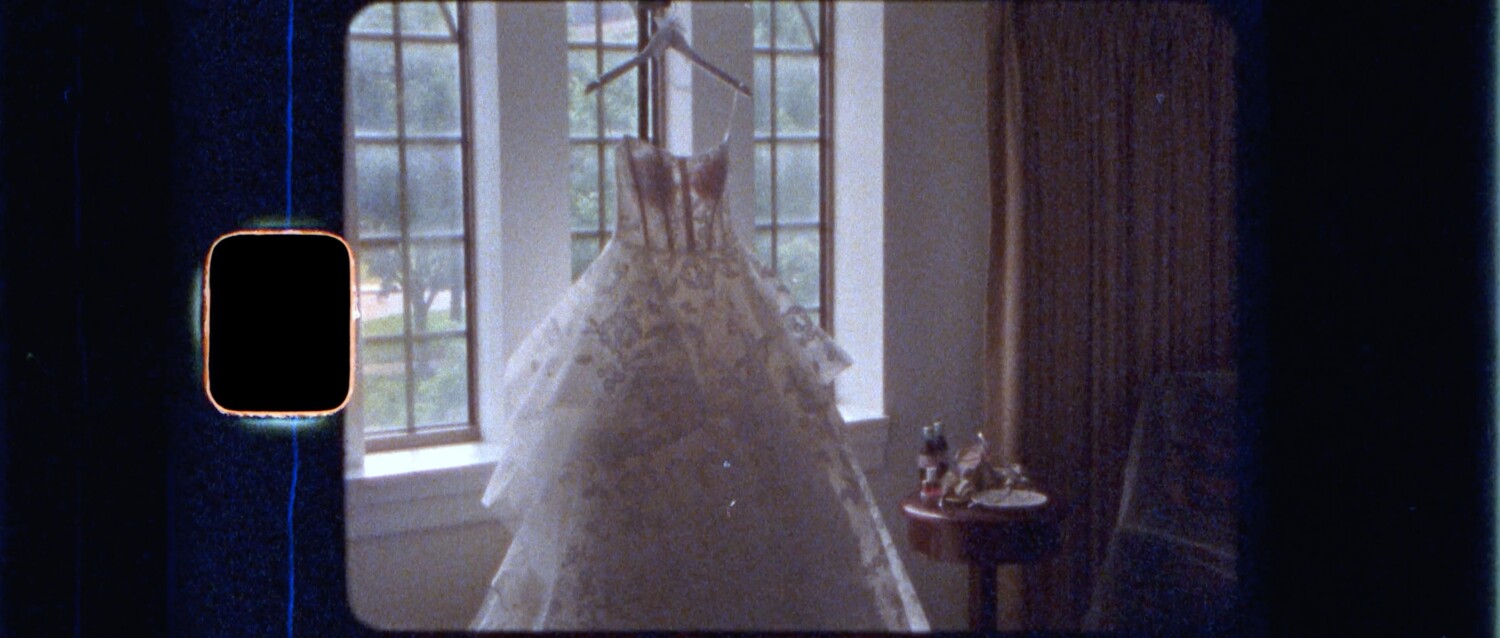 wedding dress hanging in a window of the Morris In on Notre Dame campus filmed with super 8mm film